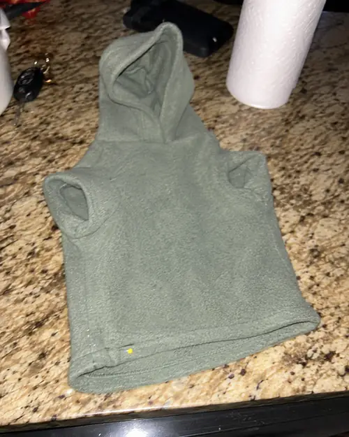 Finished handmade dog hoodie on the kitchen counter
